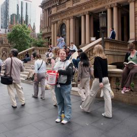 Buskers, Collector seeks donations at Sydney Town Hall, 'Stop AIDS Now', George Street Sydney, 2004