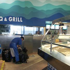 Fish Market's employee sealing bags, Bank Street Pyrmont, 2003