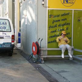 Fish market's employee eating outside Nicholas Seafood, Bank Street Pyrmont, 2003