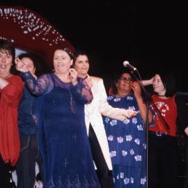 Celebrity line up on stage at Women's Music Festival, Mardi Gras, 2000
