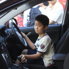 Child in a new Holden, Chinese New Year Launch, Belmore Park Sydney, 2013