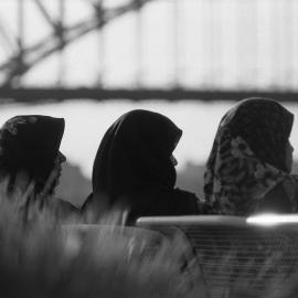 Veiled women sitting on bench looking out to Circular Quay Sydney, 1994