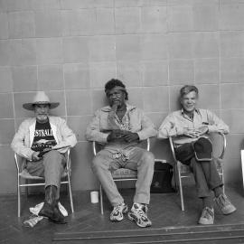 Three Men sitting on chairs, Circular Quay Sydney, 2003