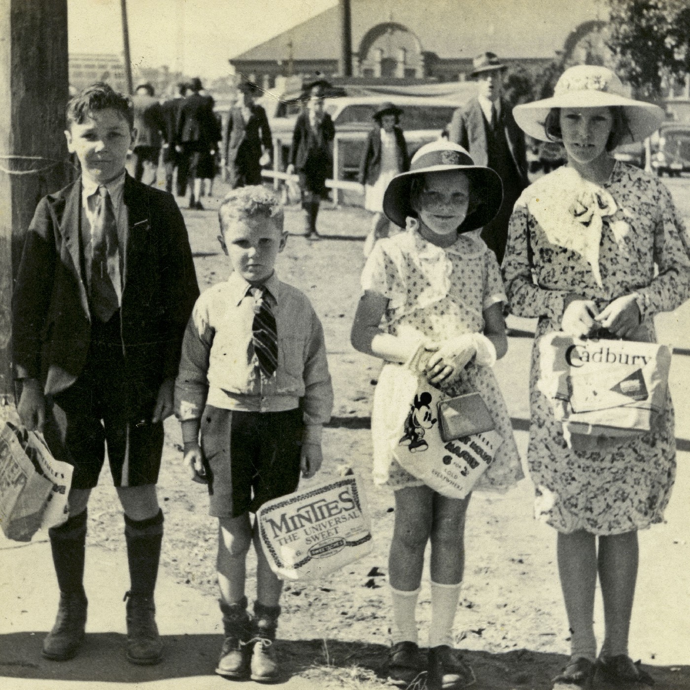 Children with show bags at the Sydney Royal Easter Show Moore Park, 1938 (A-00033774)