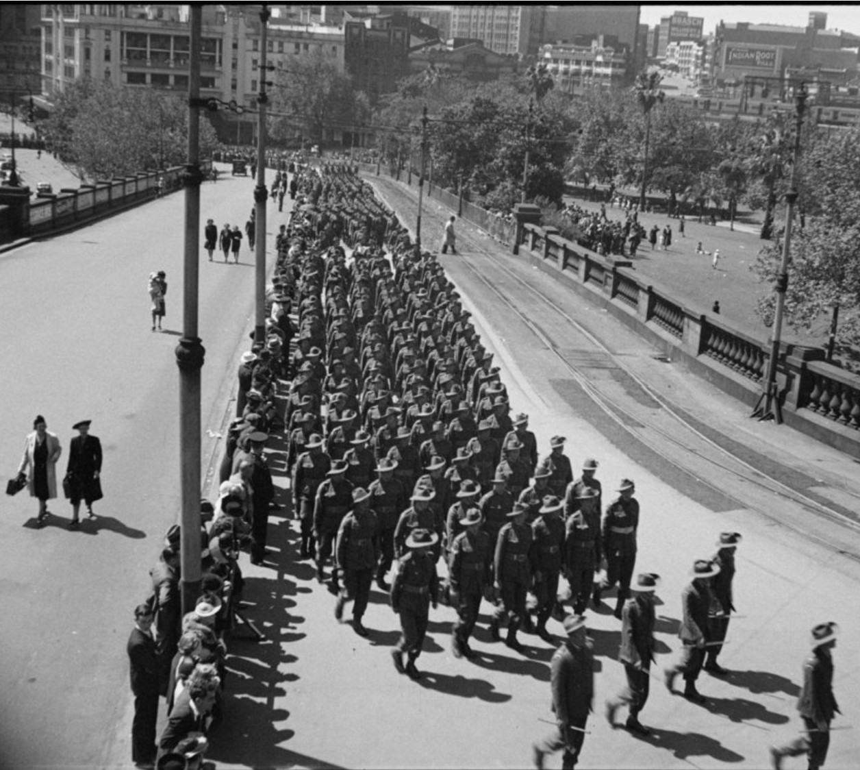AIF troops marching towards Central Station, Haymarket, 1940 by Percy James Bryant (A-01142076)