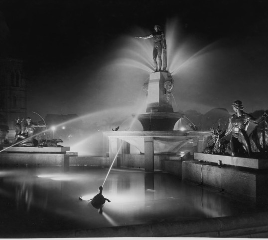 The Archibald Memorial Fountain in Hyde Park illuminated at night, Elizabeth Street Sydney, 1937 (A-00014767)