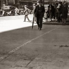 Traffic mark at intersection and wood blocked road surface, Market Street Sydney, 1929