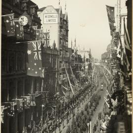 Print - Street decorations and troops, George Street Sydney, 1920