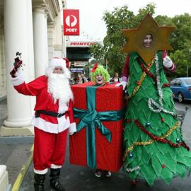Santa with actors dressed as Tree and Gift Box outside post office building, Glebe, 2003
