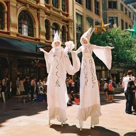 Street entertainers walk on stilts, Pitt Street Mall Sydney, 2004