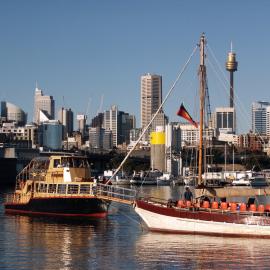 Ferry and 'Tribal Warrior' with cityscape in background, Blackwattle Bay, 2004