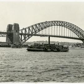 View of ferry and Sydney Harbour Bridge, circa 1937-1938