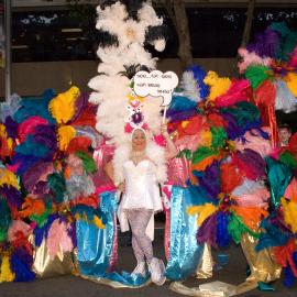 Person in white in front of huge rainbow wings,  2 Sydney Gay & Lesbian Mardi Gras, 2008