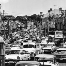 Heavy traffic in both directions, Bayswater Road Darlinghurst, 1964