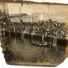 Andrew 'Boy' Charlton being rowed by Arne Borg in a victory lap, Woolloomooloo Bay, 1924