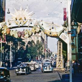 Sun arch decorations for royal visit, Bridge Street Sydney, 1954