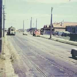 Traffic and tram on South Dowling Street Waterloo, 1955