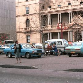 Train strike parking and pedestrians in front of Customs House Sydney, 1984