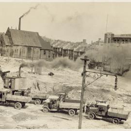 Trucks at the excavation site, Brisbane Street area resumption Surry Hills, 1928
