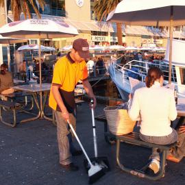 Fish market's employee sweeping, Bank Street Pyrmont, 2003