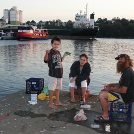 Fishmarkets with two children and an adult fishing from Trawler Wharf, Bank Street Pyrmont, 2003