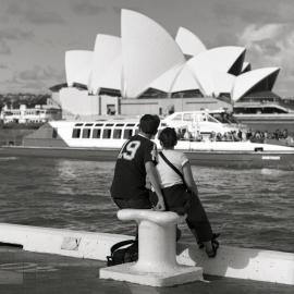 Couple watch ferries, Circular Quay Sydney, 2001