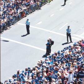 Police and Spectators along the route of the Olympic Tickertape Parade, George Street, Sydney, 2000